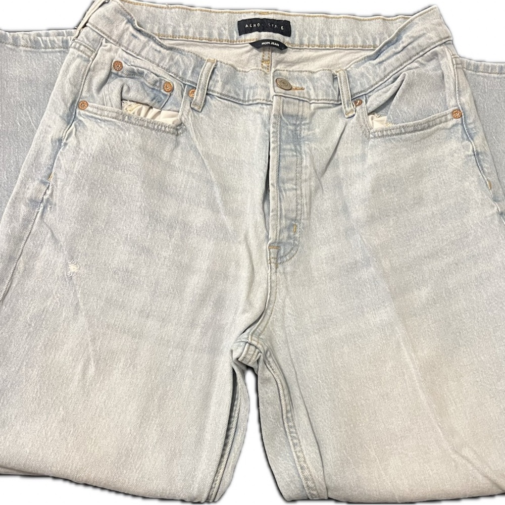 Light blue distressed denim jeans